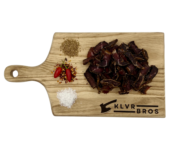 Beef Biltong Hot n Spicy on wooden board